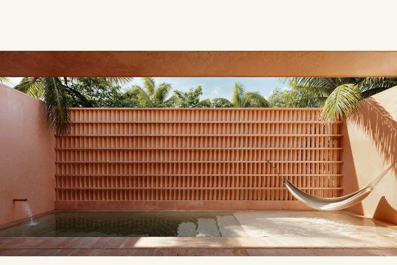 Ahau Gardens Villa 2: pool with a hammock and brick backdrop