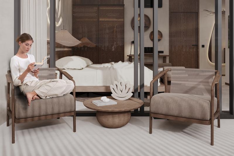AURA Apartment: armchairs in a sitting corner by the bed