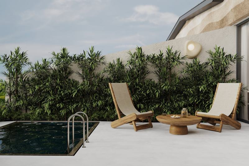 AURA Jungle Temple: loungers beside the pool along the villa wall