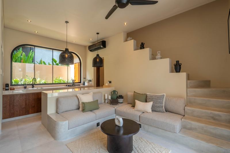 Bingin patio villa: sofa by the staircase