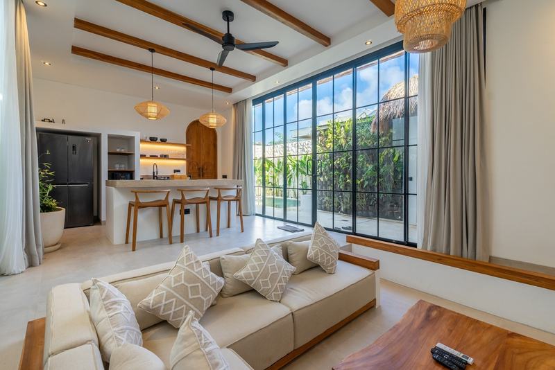 Bingin one-bedroom villa: sofa in the living area with the kitchen behind