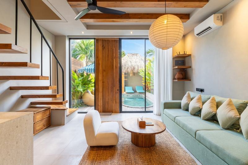 Bingin courtyard villa: living room opening onto the water