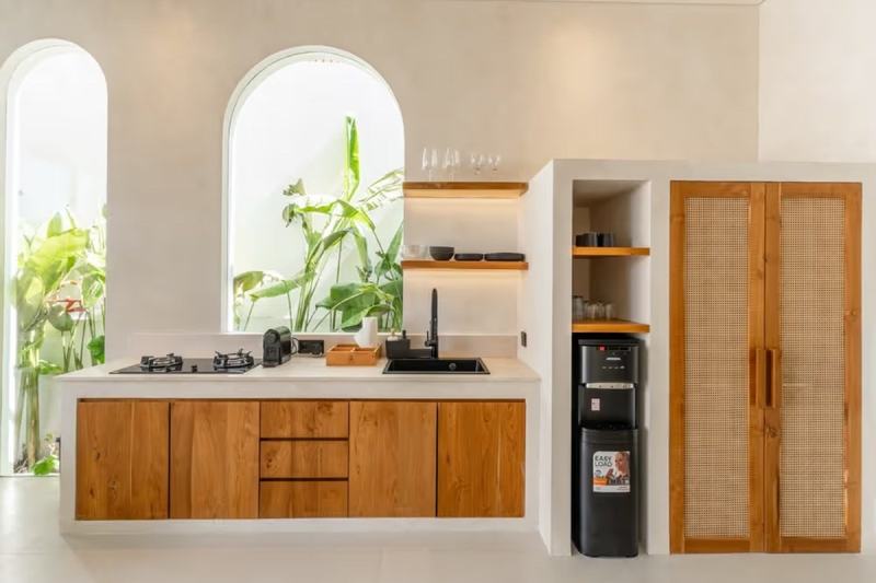 One-bedroom villa in Bingin: timber kitchen fronts and shelves in a niche