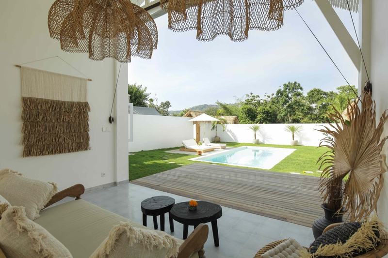 Bingin two-bedroom villa with a lawn: lawn and pool seen from the terrace