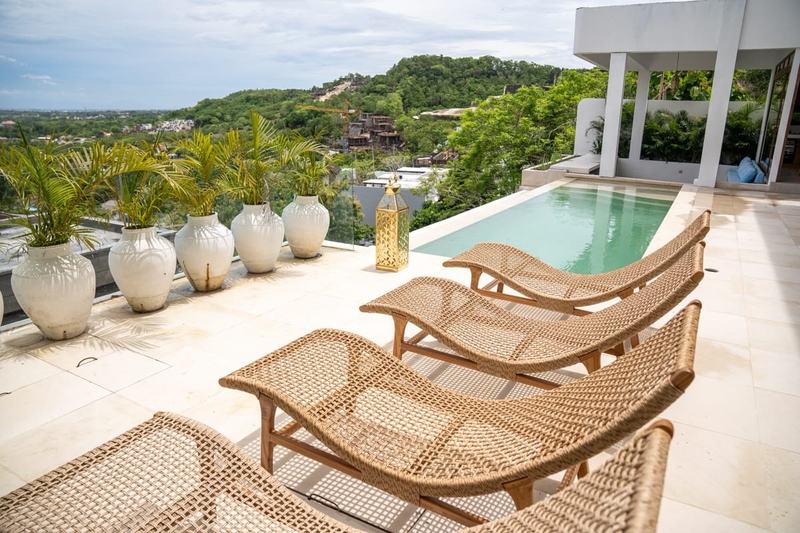 Hilltop villa in Bingin: pool and loungers on a terrace with a wide view