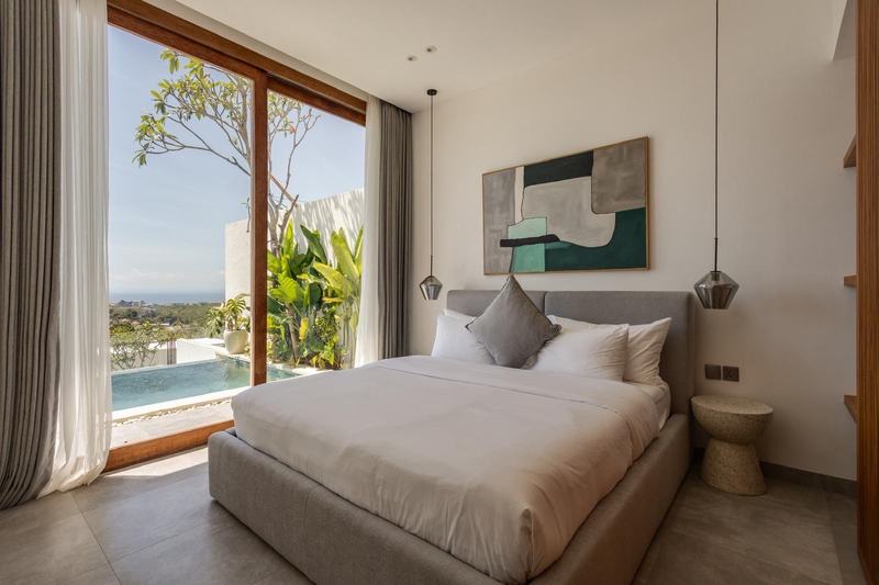Sunset-view villa in Bingin: bedroom opening onto the pool