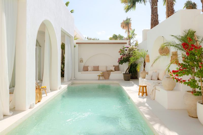 Mediterranean-style villa in Bingin: long pool beside a white courtyard