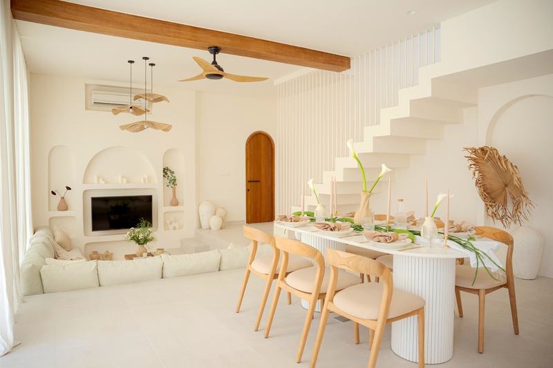 Mediterranean-style villa in Bingin: living room with a fireplace and dining area