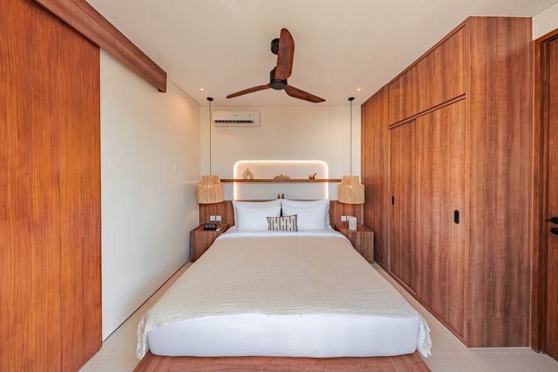 Two-story villa in Bingin: bedroom with wooden wardrobes