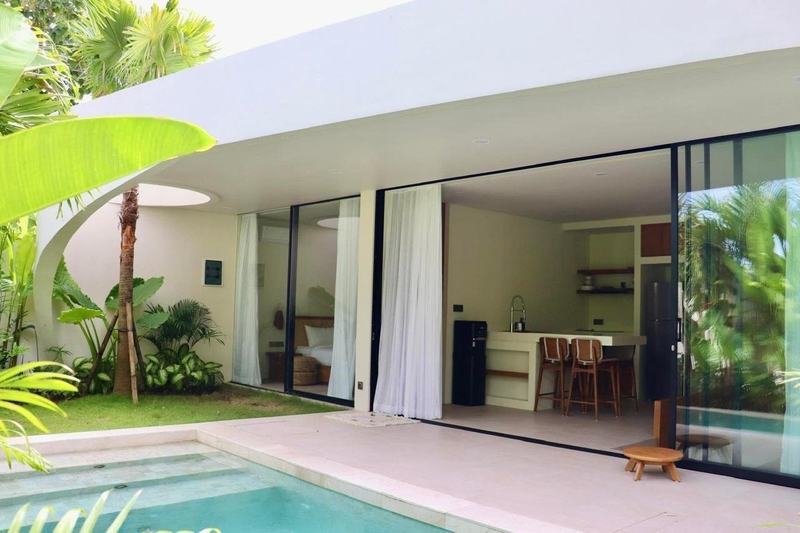 Bingin garden villa, two bedrooms: pool and living room behind sliding glass