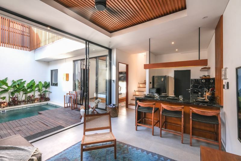 Two-bedroom villa with a louvered terrace, Bingin: kitchen and living room opening to the pool