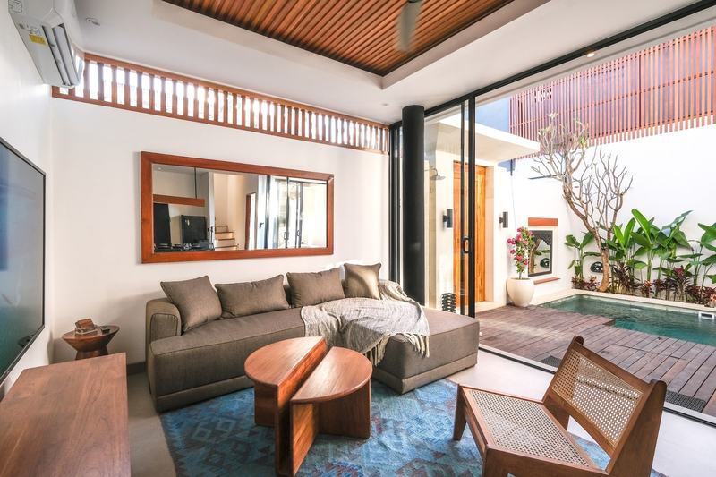 Two-bedroom villa with a louvered terrace, Bingin: living room sofa facing the pool