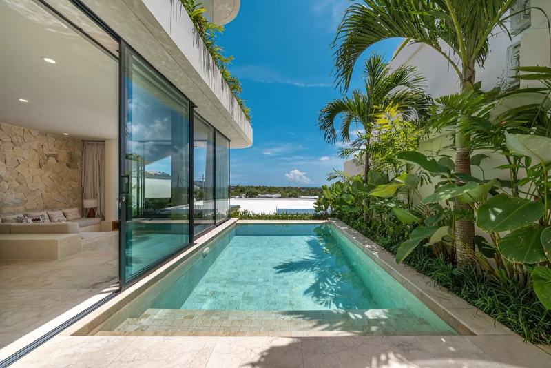Three-bedroom villa in Bingin: pool along the glass facade