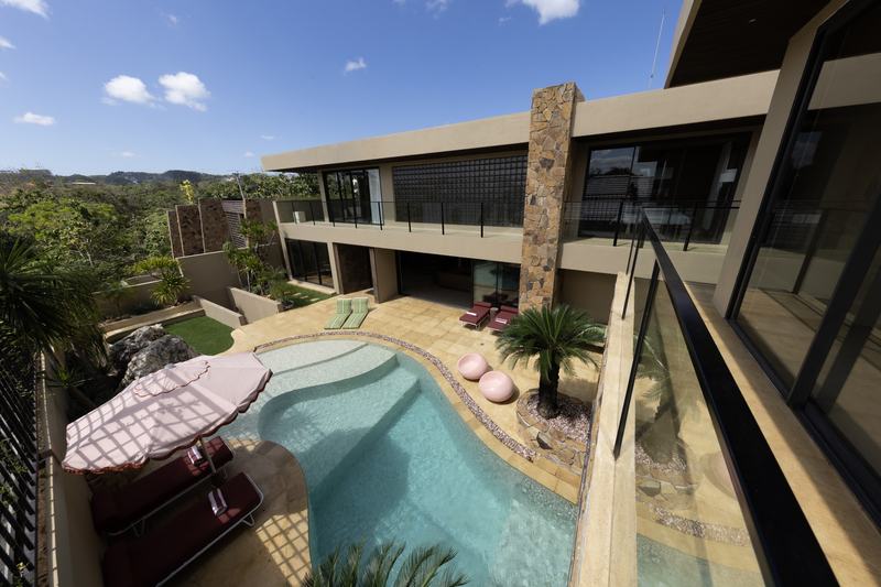 Four-bedroom villa in Bingin: living room with a staircase and pool access