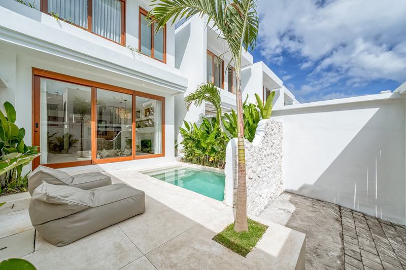 Two-bedroom villa in Balangan: white facade over the pool