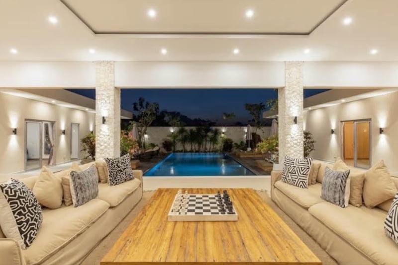 Seven-bedroom villa in Balangan: living room opening to the pool