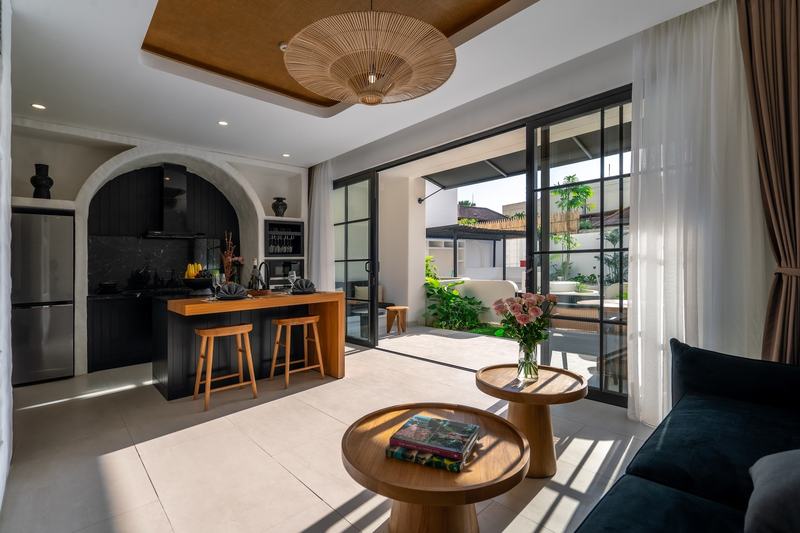 One-bedroom apartment in Canggu: living room and kitchen opening to the terrace