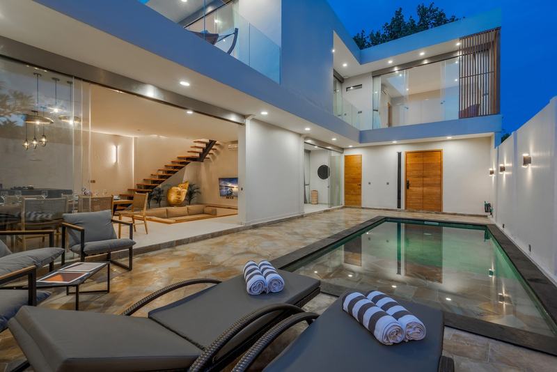 Three-bedroom villa in Padonan, Canggu: the pool at dusk