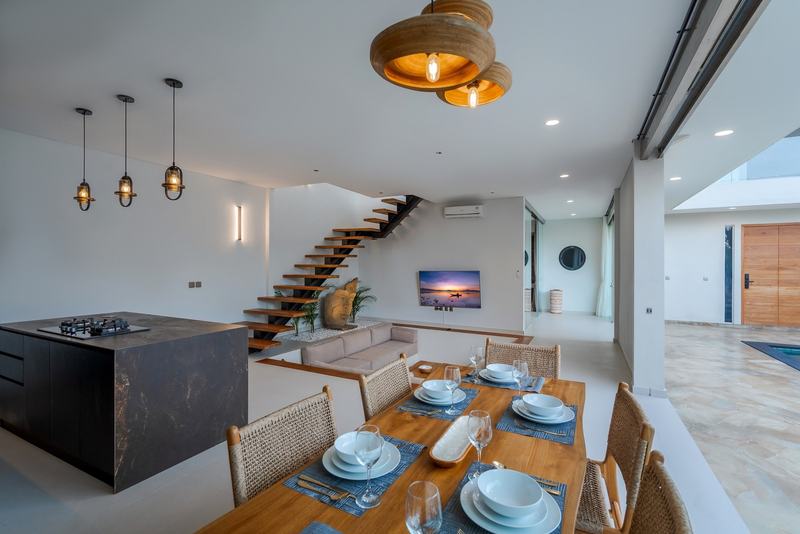 Three-bedroom villa in Padonan, Canggu: dining area and island kitchen