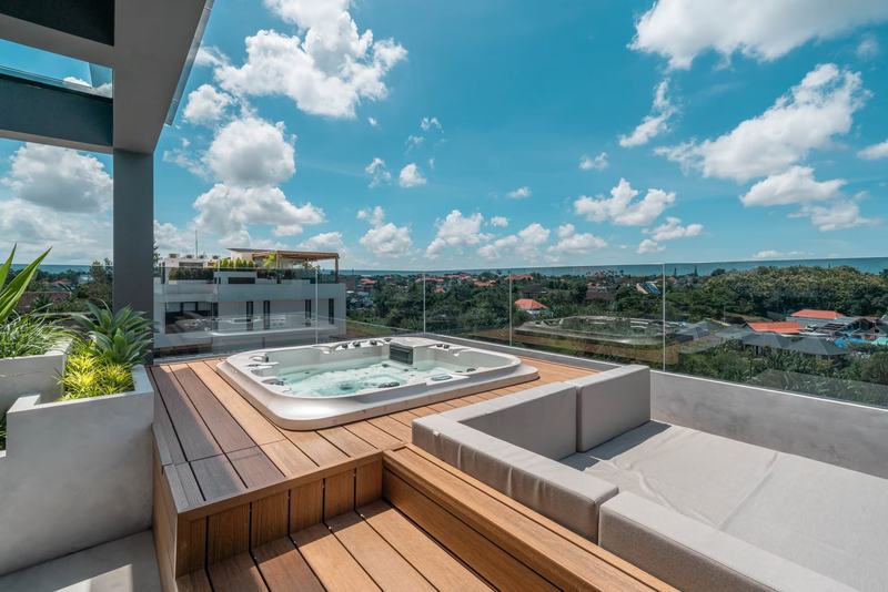 Four-bedroom villa with a rooftop terrace, Canggu: rooftop Jacuzzi above the trees