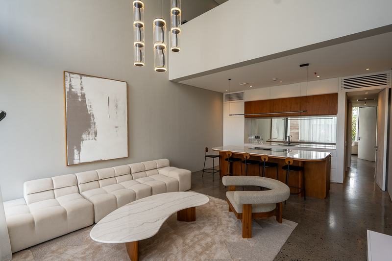 Ecoverse: living area of the showroom suite with an island kitchen