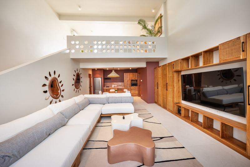 Gate 11 mezzanine: double-height living room below the upper gallery
