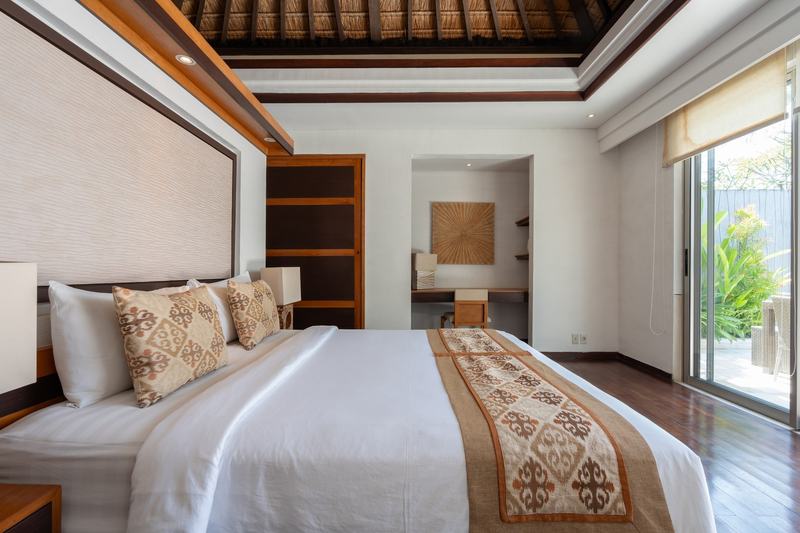 Jimbaran three-bedroom villa: bedroom opening onto the garden
