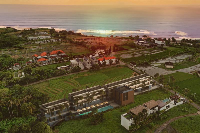 Kedungu Baza residence among rice fields near the ocean at sunset, render