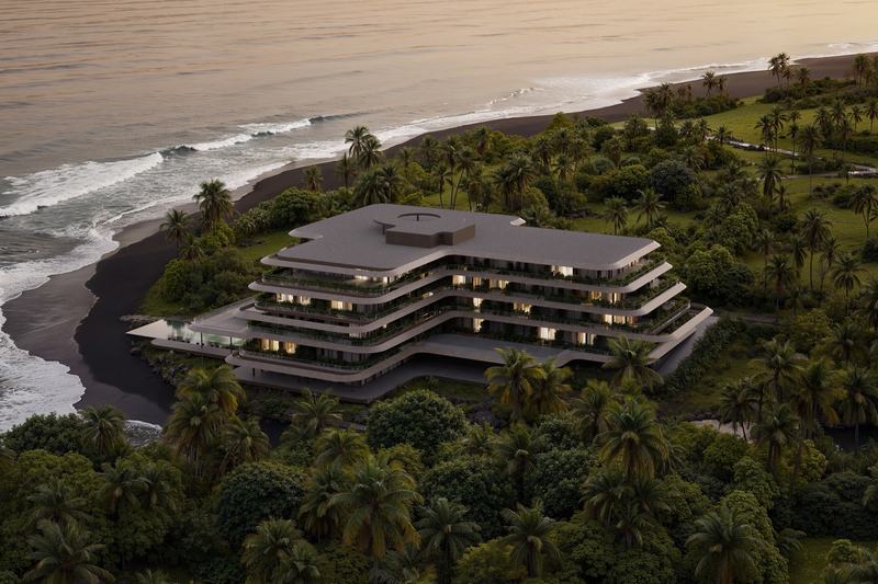 Luna Residences: aerial view of the building between the ocean and the river mouth