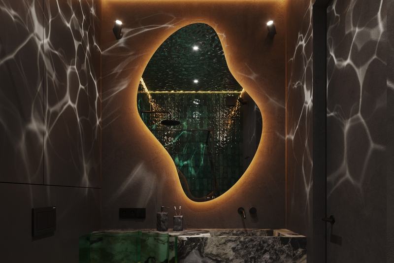 Manta Seaborne 1BR: bathroom with a shaped mirror and stone vanity
