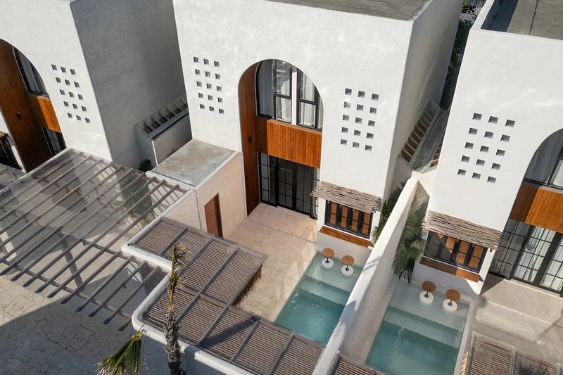 Nila Residence: drone view over pools and patios