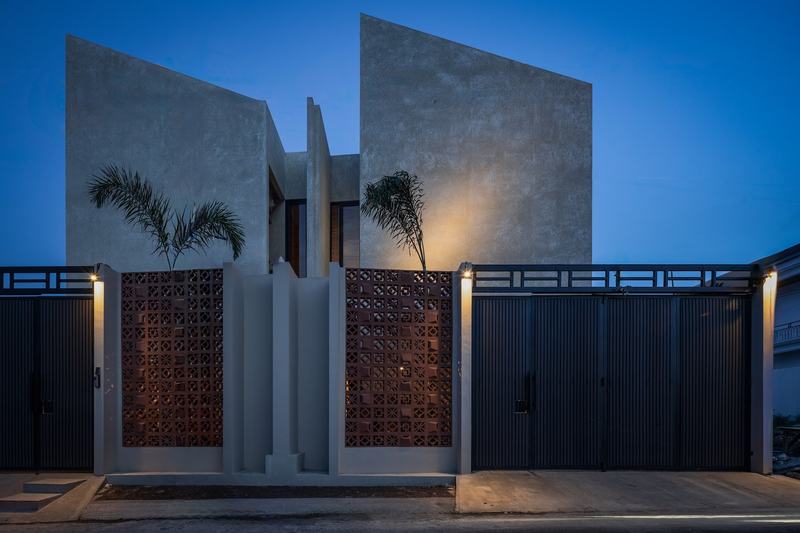 Two-bedroom villa with a pool, north Nusa Dua: brick-screen facade at dusk