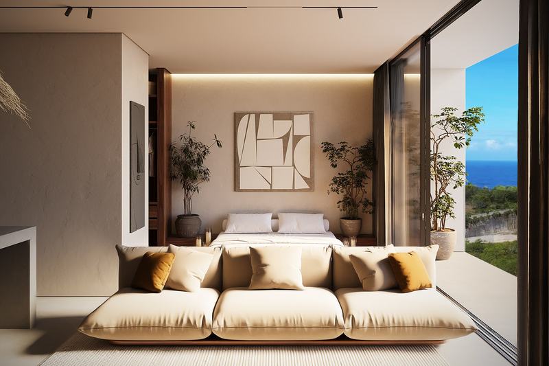 Pandawa Hills: studio sofa by a sliding window with an ocean view, developer's render