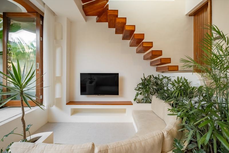 Pecatu two-bedroom villa: living room and floating staircase