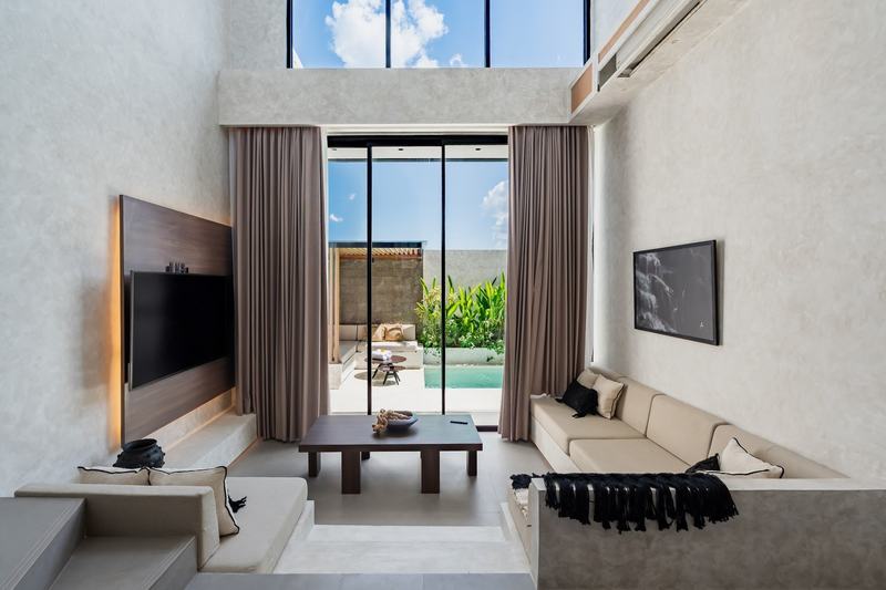 Rice-view villa in Pererenan: living room opening to the pool