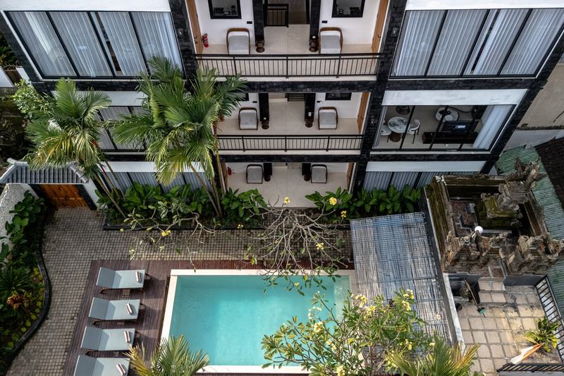 Sebelas Apartments: drone shot of the pool between the two buildings, developer photo