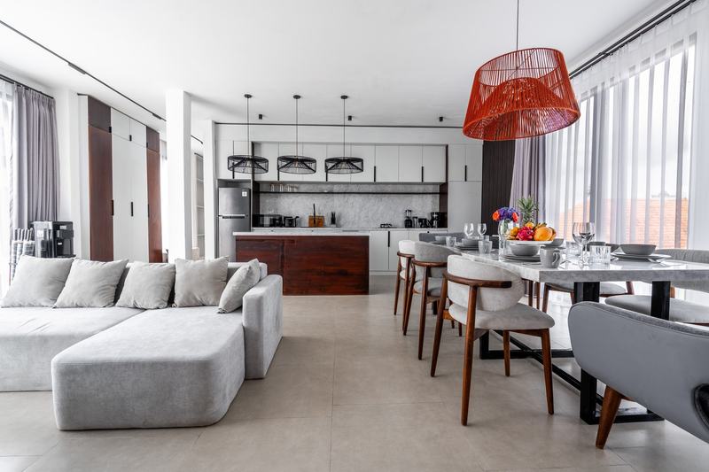 Sebelas Apartments: three-bedroom kitchen with island and eight-seat table, developer photo