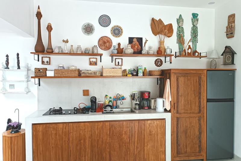 Two-bedroom villa in Seminyak: kitchen with open wooden shelves