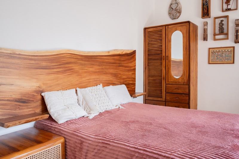Two-bedroom villa in Seminyak: bed with a solid timber headboard