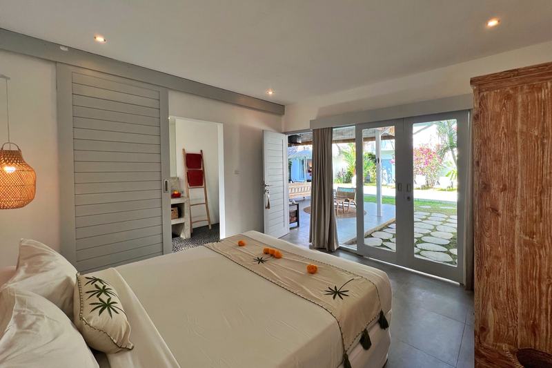 Four-bedroom villa in Seminyak: bedroom opening to the garden
