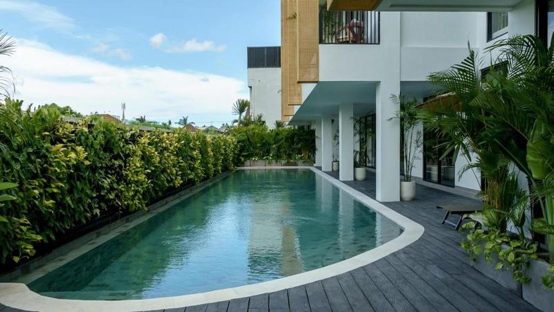 Sunny Aparts I: pool along the building and a living green wall, developer photo