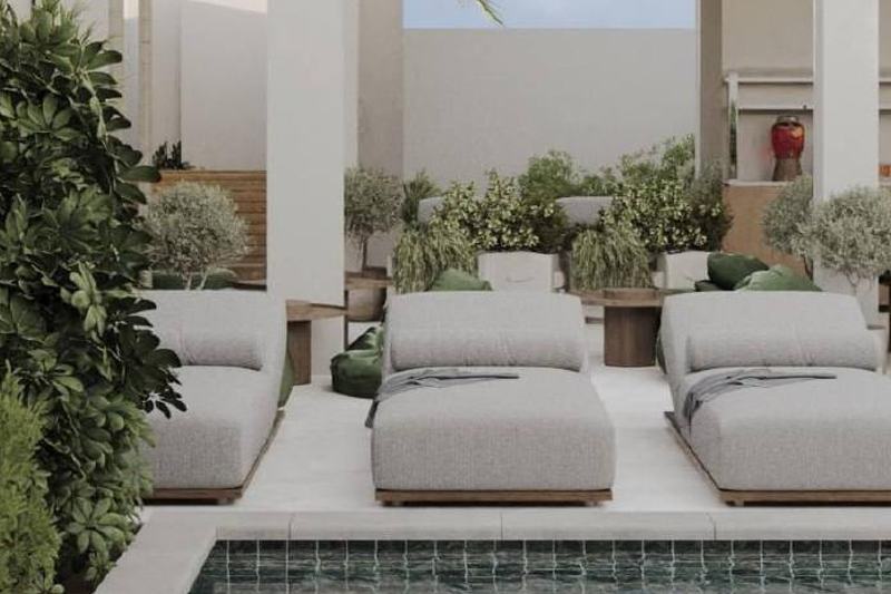 Sunny Muse: sunbeds by the pool and an outdoor kitchen, developer render