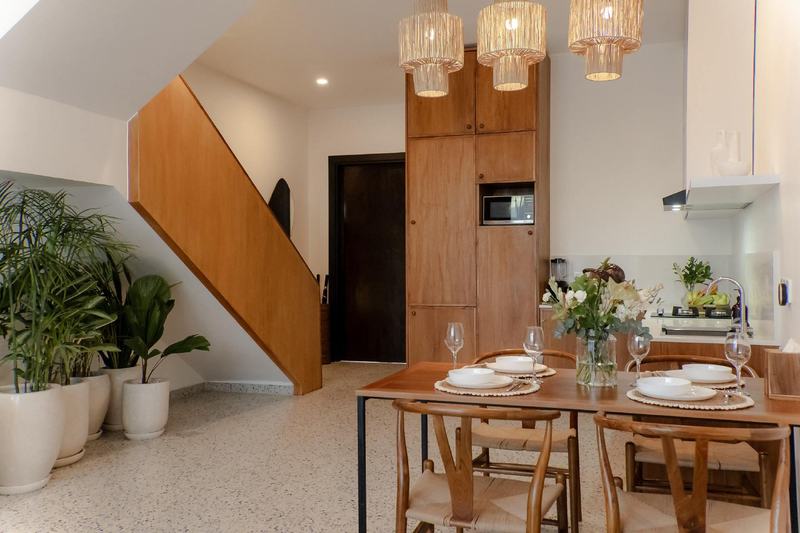 Sunny Nine: dining table, kitchen and stairs to the upper floor, from the developer's presentation