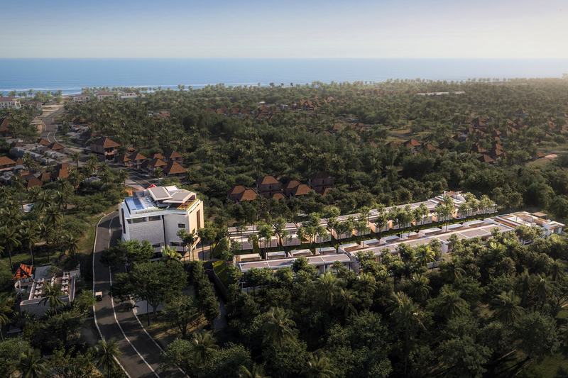 The Ease Canggu: aerial view of the complex with the ocean behind