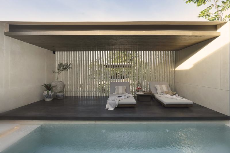 The Ease Canggu: loungers beside a villa pool