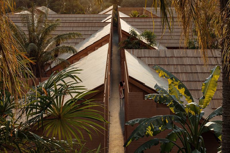 The Pavilions render: lane between villas, roofs and palms from above