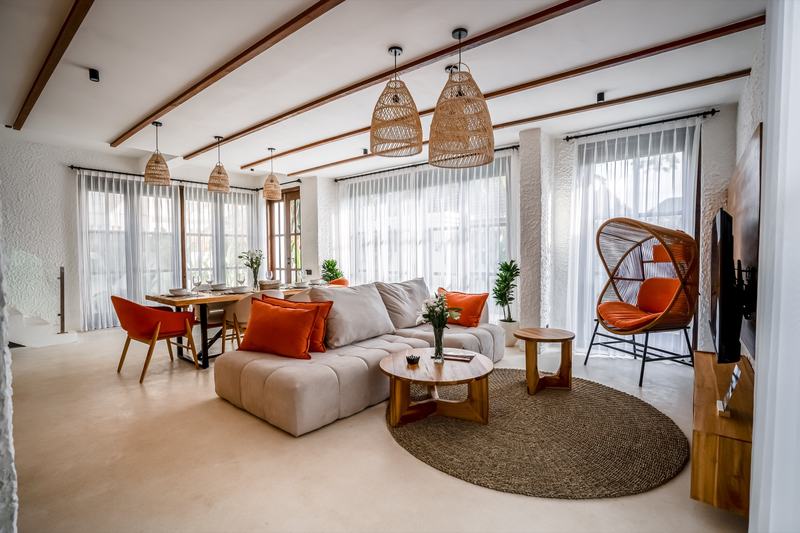 Tropical Tribe: living and dining area under timber beams