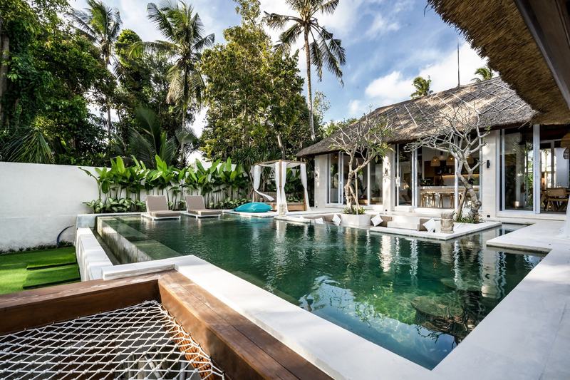 Four-bedroom villa in Sayan, Ubud: pool and thatched pavilions