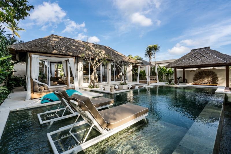 Four-bedroom villa in Sayan, Ubud: pool with loungers set in the water