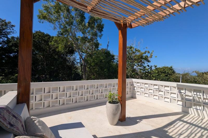One-bedroom villa in east Uluwatu: roof terrace under a timber pergola
